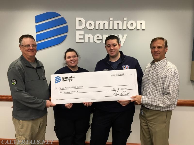 Captain Hiepler and Lt Madariaga receive a generous donation to CALS from Dominion Cove Point for their efforts in saving the life of one of the Dominion employee.