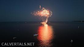 The Twin Beaches Firework show being launched from barges in the Chesapeake Bay.